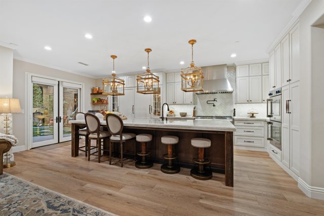 The view of the kitchen from the great room.  Spacious with plenty of room to spread out and entertain!