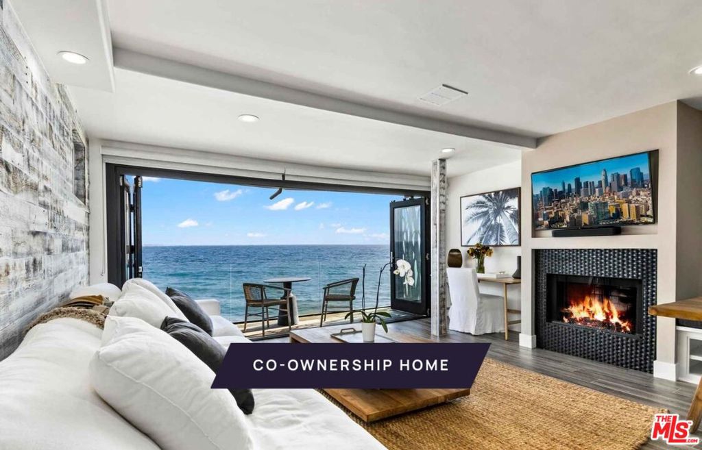 New co-ownership opportunity: Own one-eighth of this turnkey home, professionally managed by Pacaso. The Pacific is front and center in this contemporary oceanfront home that maximizes the views and beach lifestyle. The living space features a dining area with banquette seating, a brick fireplace and bi-fold French doors that open to a cozy covered deck. The kitchen has stainless steel appliances, a double-drawer dishwasher and access to the 2-car garage.  Skylights bring warm shafts of light throughout the second floor. The zen-like primary bedroom features bi-fold doors to a private balcony overlooking the ocean, a modern fireplace and an en suite bathroom with soaking tub, dual-sink vanity and a marble tiled shower. Another bedroom and a bunk room ensure there's plenty of room for guests.  Below the main floor, the nearly 1,000-square-foot foot deck has been transformed into an entertainment haven, featuring a tiki bar, dining table, chair swings and a motorized, waterproof door. The home comes fully furnished and professionally decorated.