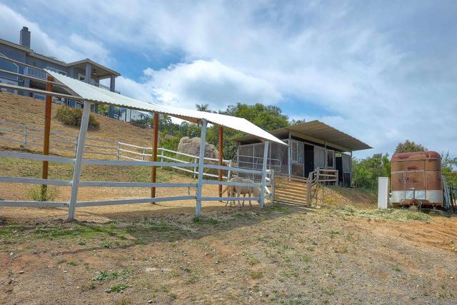 Horse pasture with 2 stall barn below 1st home.