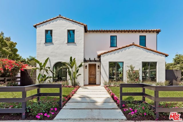 Ideally positioned on an expansive corner property, this Mediterranean-style residence spans over 3,800 square feet and sits within walking distance to Venice's famed beaches, restaurants, boutiques, and parks. Crafted with a romantic aesthetic, Mediterranean design elements are woven throughout, including wrought iron railings, plaster walls, curved archways, a clay shingled roof, and exposed beams, while heightened ceilings, an abundance of windows, and hardwood oak flooring  generate a bright and airy ambiance. The first-floor layout flows effortlessly with a formal dining room, a grand living room, a powder room, secluded ensuite bedroom, and a high-end kitchen, complete with stone countertops, bespoke cabinetry, oversized island, and chef-grade appliances. Disappearing walls of glass provide an indoor/outdoor flow to the private yard, outfitted with lush landscaping, glimmering pool with spa, and smart hardscaping. On the second level, two sizable secondary bedrooms, each with ensuite bathrooms, lead to the primary suite which showcases a fireplace, custom walk-in closet, private balcony to overlook the property, and a spa-grade bathroom. Rounding out the residence is a separate laundry room and a detached two car garage.