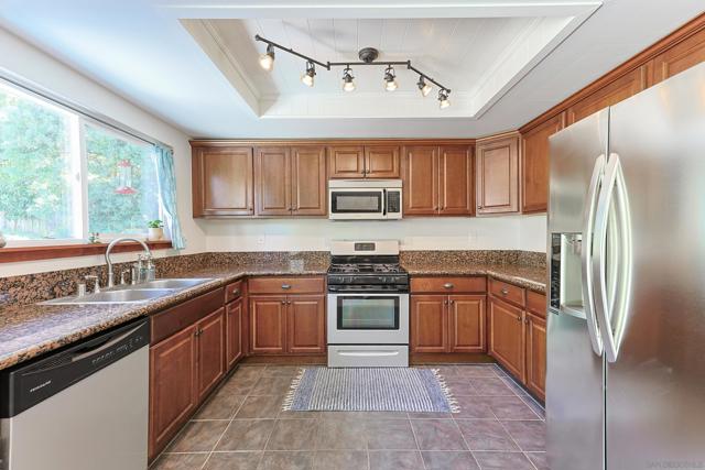 spacious kitchen with granite countertops