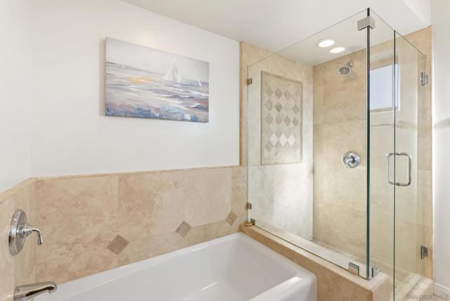 Stone and glass unite in a tranquil suite bathed in soft, natural light.