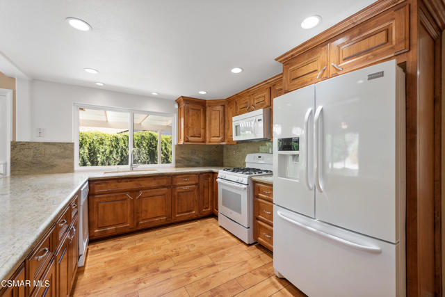 Kitchen, lots of cabinets and windows