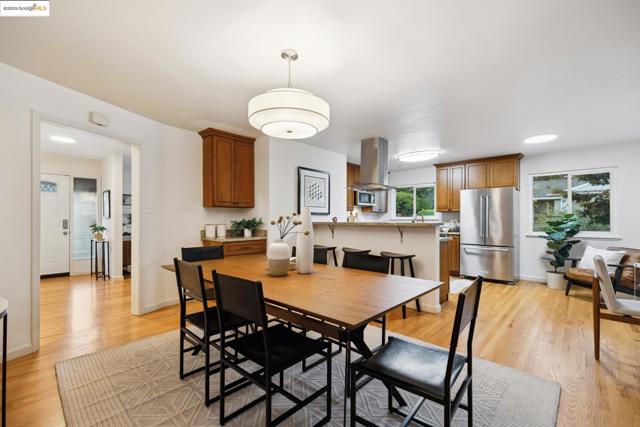 Dining area featuring light wood finished floors and baseboards