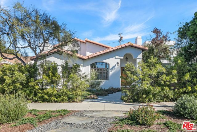 2900 Clune Avenue Venice, California Nestled on one of the best blocks in Venice and only 4 blocks to the beach, this lovingly reimagined Mediterranean home is filled with surprises. Welcome your guests into the double-height living room with multi-paned windows that frame the beautifully xeriscaped front garden, and let in all of that Southern California light. Grand enough for entertaining (game night, anyone?) yet cozy enough for a lazy afternoon nap, a wood burning fireplace is a stunning centerpiece to the space. The heart of the home is the chef's kitchen with high end stainless steel appliances (Wolf, etc.) and lots of storage. Set a table for 8 in the dining room, or open the French doors to the back garden and take the party outside. A Saltillo tiled courtyard patio hosts both outdoor dining and living rooms, and spills into another lushly landscaped garden and raised organic vegetable bed. Both generously sized bedrooms feature en-suite baths, one upstairs, and one down. The detached garage with additional 2-car parking in the rear also features an attached "bonus" room which opens to the patio. Close to great dining (Charcoal, Beach & Brew) and the beach, and a quick jump to all the shopping and dining on Abbot Kinney or Rose Ave.