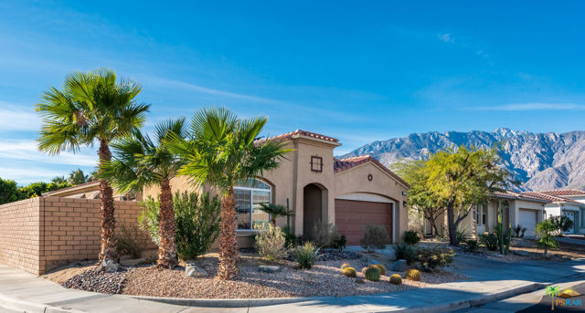 Located in Four Seasons - a gated active adult community for people 55 and better. Showcasing a versatile, open floor plan, this popular Palm I residence boasts a 20-year transferable leased and fully pre-paid Sunrun solar system - installed in October 2014. New AC was installed in May 2018. This floorplan features 1,900 sq ft of living space with a formal dining room and a family room which is open to the breakfast nook and kitchen. The center-island kitchen is ideal for entertaining and has slab granite counter-tops, stainless appliances and an abundance of nice cabinetry. From the family room, you are ushered out to the private rear yard with lemon, orange, tangelo & grapefruit trees, a very large 10' x 12' (inside dimensions) salt-water boutique pool/spa and a nice view of the majestic Mt. San Jacinto. The spacious primary suite offers optimal privacy, a large walk-in closet and newer sliding doors leading out to the private rear yard. Dual sinks and a newer updated large shower and lighting completes the master bath. Current owners are using the front-facing room as the guest bedroom, providing maximum separation and privacy. Both bedrooms and the office/den have been updated with new laminate flooring that closely resembles real hardwood. A separate laundry room consists of a side-by-side washer & dryer, ample cabinetry and a deep sink. The community offers a fully staffed lodge 7 days a week, heated pools, spas, outdoor BBQ area, tennis, pickle ball, bocce ball, hand ball, paddle ball & basket ball courts, horseshoe pits & walking trails. Scores of resort-style amenities include; fitness center & aerobics, computer lab, ballroom, game room & library. And always a calendar full of social events to enhance everyday living. And minutes away is the very heart of Palm Springs packed with energy, excitement, restaurants, shopping, social establishments, the Agua Caliente Casino and so much more.