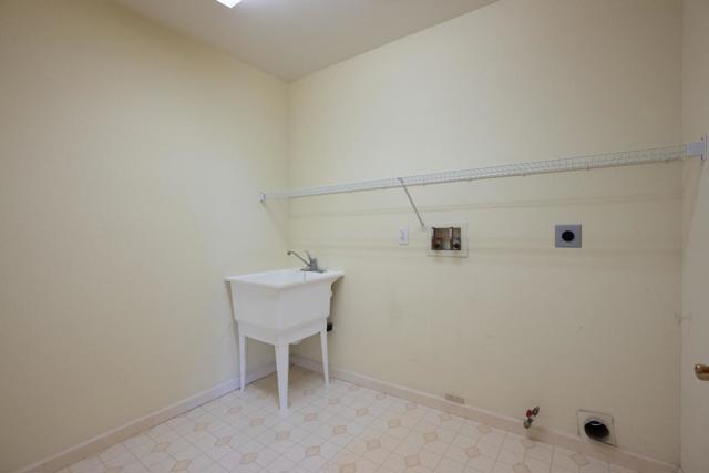 Laundry room in kitchen/family room area