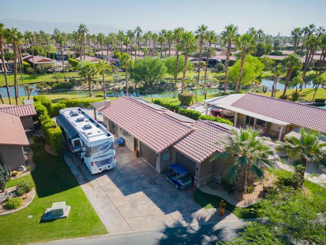 LUXURY RV RESORT IN INDIO, CA:VILLA FEATURESCustom Floor PlanMain Living:              895 Sq. Ft.2-Car Garage:          755 Sq. Ft.TOTAL:                   1,650 Sq. Ft.ROOMS:Great Room/KitchenInterior Laundry RoomMaster Retreat withKing Bed space.Spacious Bathroom with Large Travertine/Stone Shower +His and Her Bathroom spaces.Wardrobe Closets2-Car Garage(Temperature Controlled w/ 3-ton mini-split)INTERIOR FEATURESGreat Room/Kitchen withNatural Wood Cabinets, Granite Slab Counters, Center Island Snack Bar, and Stainless Steel Appliances include:Sub-Zero RefrigeratorOven-Range with Range Exhaust.New Dishwasher (Kitchen-Aid)U-Line Wine ChillerReverse Osmosis Water at Sink.New Ceramic Plank Tile Flooring.Automated Window Treatments.FAU system + Mini-Split in Great Room.Surround sound in the Great Room.Corner Fireplace.Crown Molding.Stacking Slider Glass Doors to Patio.Fresh Interior Paint.Culligan Soft Water System.EXTERIOR FEATURES New Renova Solar System keeps power bills to a minimum.(29-Panel, 12.325Kw)Freeform Pool w/ Quartzite Spa with new pebble tech finish and new pool pumps, filter and heater.Expansive Pergola over Patio.Wrought-Iron Doggie Fenced Yard.Eldorado Stone Exterior.Textured, Colored Concrete.Security Shutters.Stacking Glass Doors to Patio.