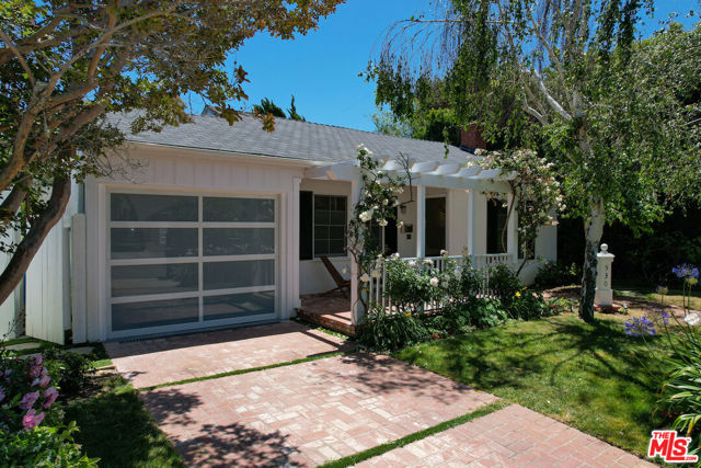 Welcome to this Charming Traditional in the dreamy El Medio Bluffs on one of the most loving streets in Pacific Palisades. Walk up to a front yard covered in flowers that takes you to the front brick patio. This will take you to the bright and inviting living room with original wood floors and a fireplace. Two of the three bedrooms leads out to the wood covered back patio and the large and enchanting grass backyard. Tiled kitchen also leads out to the patio and potential bbq area. Central AC and recessed lightning. Private garage that is ready for electric charger to be installed. A few blocks to the iconic brand new Palisades Village by Caruso and Palisades Bluffs with ocean views and increddible sunsets.