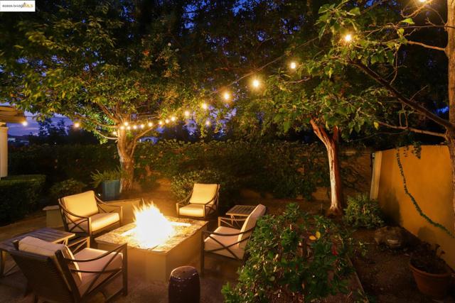 Patio at twilight featuring an outdoor fire pit and a patio area