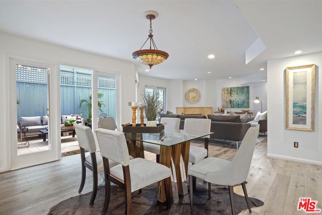 928 7TH Street 2 Santa Monica, California Sunny coastal condo with a unique, expansive outdoor space that flows seamlessly from the living areas inside. This three bedroom, two and a half bath split-level condo provides the perfect space for ideal Santa Monica living. Enjoy the ocean breeze while lounging, dining, and entertaining on the spacious outdoor patio, spanning over 500 sqft. An open dining and living area welcomes you with an elegant fireplace, mirrored built-ins, and doors that open to the patio for coveted indoor/outdoor living. The stylish, recently updated kitchen features stainless appliances, a gas range, double oven, wine fridge, and an eating area. Completing the main level is a powder room and an additional room that can be used as a third bedroom or as an office/flex space. Up a few steps, a hallway leads to the bedrooms and a laundry room. Retreat to the primary suite featuring a fireplace, large walk-in closet, and a dual-vanity bathroom complete with a walk-in shower and a bathtub. Additional features include controlled building access and two side-by-side parking spaces with an EV charger and storage cabinets in a secure garage with elevator access. This residence is ideally situated a block from the shops and restaurants on Montana Avenue, walking distance to the beach and Palisades Park, and located in the highly desirable Santa Monica school district, just blocks from Roosevelt Elementary and Lincoln Middle School.