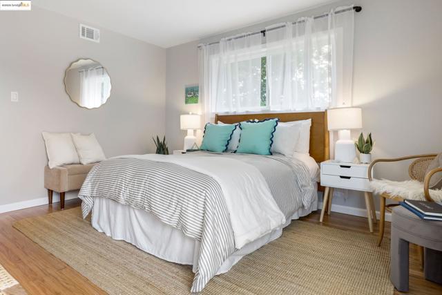 Bedroom with light wood-style floors and baseboards