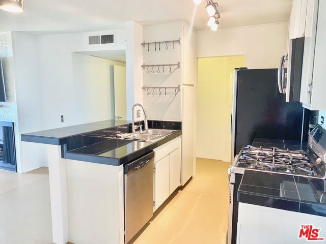 Sleek Stainless & Granite Kitchen