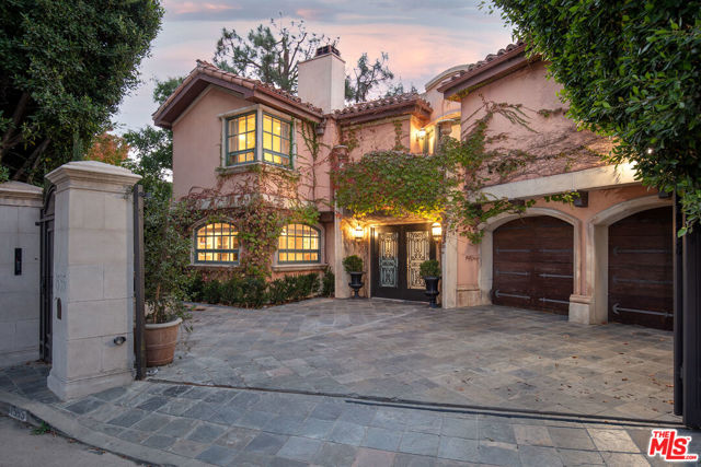 1595 Lindacrest Drive Beverly Hills, California Gated 3-story Tuscan villa custom built. Light, bright, and open with a great flow for entertaining. Featuring extraordinary entertaining spaces with high ceilings, dramatic 2-story skylit entry gallery, large living room, dining room, theater, gym, and more. Located on one of lower BHPO's most coveted streets, enter through a gated courtyard with lovely fountain. Gleaming hardwood floors, French doors, and very high quality materials throughout. 3 luxurious bedroom suites upstairs, (including an owner's suite with dual walk-ins and gorgeous granite bathroom), and 2 bedroom suites on the lower level (one is a convertible gym). Beautiful lap pool/spa, outdoor kitchen with BBQ, overlooking canyon views. Direct entry garage for privacy and security.
