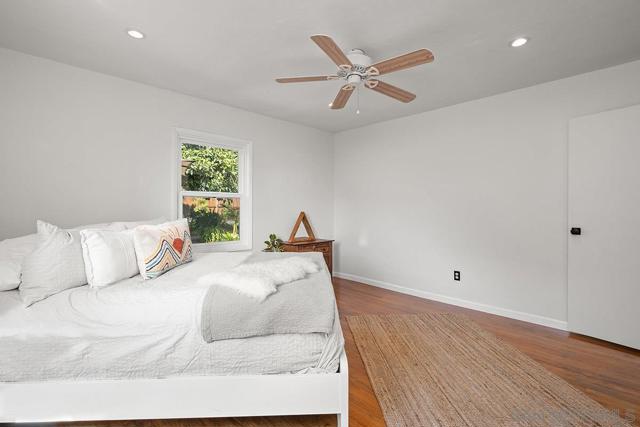 3rd upstairs bedroom; orientation in back of house with views of backyard landscaping.
