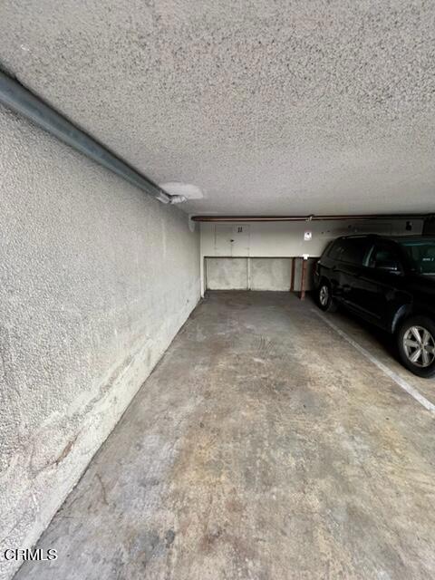 Parking space with storage locker