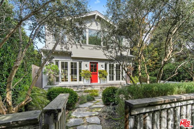 821 Nowita Place Venice, California Nestled in Venice on a highly coveted walk-street just blocks from Abbot Kinney and the beach, 821 Nowita Place presents a rare opportunity to reside in a stunning 3-bedroom, 3-bathroom designer-renovated Craftsman home. The fenced front yard immediately captivates with lush landscaping, a stone walkway and an inviting seating area set around a fire pit, all leading up to the striking, Dutch entry door. Sunlit and spacious, this impeccable home boasts effortless indoor-outdoor living, allowing you to bask in Southern California's year-round sunshine. With a blend of modernity and historical roots, the home features tasteful touches and high-end finishes, including reclaimed hardwood floors, shiplap walls, custom lighting, unique kitchen hardware and home tech like the security system with cameras and coded door access. The centerpiece of the main level, the seamless kitchen opens out to the living areas and features top-tier appliances including a wine fridge. Upstairs you'll find two bedroom suites, inclusive of the primary, and the laundry area. A serene retreat, the spacious primary suite has high vaulted ceilings, a reading nook with window seat, a fireplace and custom pass-through closet that leads to a marble-clad spa bath with separate shower and soaking tub. Off the rear deck is the lush backyard, offering the ideal outdoor entertaining space complete with a sleek hot tub, dining patio, BBQ grill, and access to two parking spaces. A converted garage with the same finishes as the main home provides flexible living space and may be used as a bedroom, home theater (projector included!), a studio, and more! Just moments from Abbot Kinney and the infamous Venice Beach boardwalk, this peaceful oasis has convenient access to the area's best dining, shopping and entertainment offerings including the Venice Farmers Market, Erewhon and Gjelina. Don't miss this rare opportunity to live out your dream California coastal lifestyle!
