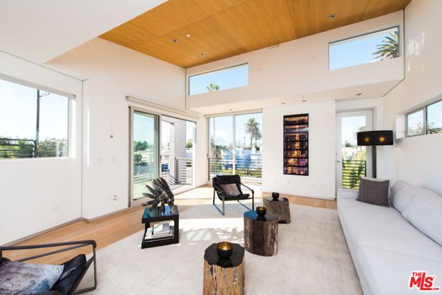 404 Grand Boulevard Venice, California Spectacular Venice masterpiece designed by award-winning Architect, William Adams. Located just off Abbot Kinney and mere seconds to the beach, this stunning corner lot architectural home encompasses the impeccable design and functional living at its best. Comprising of polished concrete floors & large block walls that work to create an industrial ambiance, this sleek 3 story home Infused light streams through the walls of windows & sliders throughout. The first floor resonates as an office flex space w/bi-fold glass & floor to ceiling doors that open onto your front outdoor space. Move onto the master bedroom & bath w/stand-alone Americh tub, oversized steam shower & Graff fixture dual sinks. The 2nd floor also houses the two spacious bdrms & bath. The 3rd floor highlights your living areas w/a Miele stainless kitchen featuring Bulthaup Cabinets, dine-in bar w/ dining areas on each side of the kitchen. Watch the Venice sunsets from your incredible roof deck - this is it!