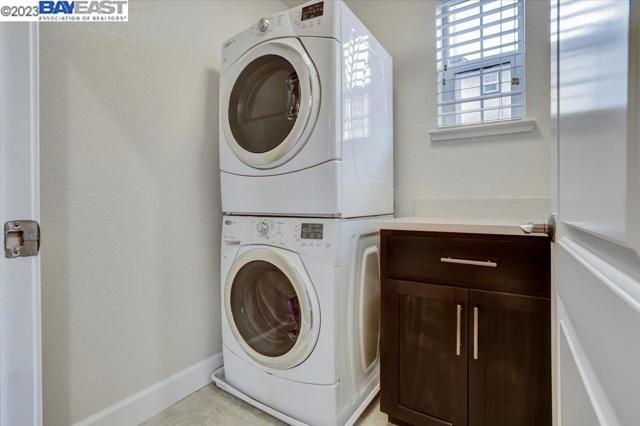 Laundry room with counter and cabinet