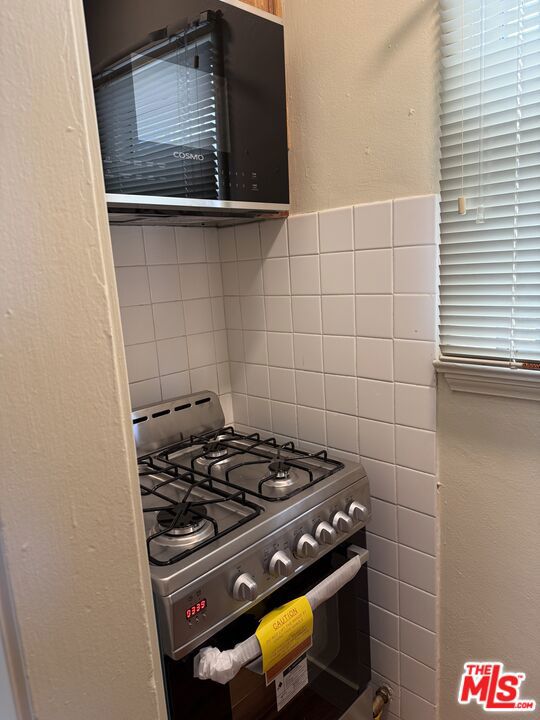 1306 S Mansfield Avenue, Los Angeles CA: https://media.crmls.org/mediaz/e8e7f4ef-ed7c-4514-ab06-eb619524f0dc.jpg