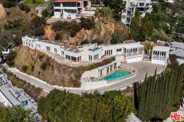 $40M dollar estates can exist here! A rare opportunity to acquire one of Los Angeles' most iconic view estates. This approximately 24,302 square foot promontory offers explosive uninterrupted ocean to Downtown views, including the Griffith Observatory, San Gabriel Mountains and jetliner ocean views. Located just minutes from the Sunset Strip, this sensational development opportunity is nestled among the stars and elite properties and deserves the attention of best architect and design. With the ability to construct approximately 10,000 sf (7,663 square feet by right plus an approximately 1,500 square foot basement plus 800 square foot ADU plus 400 square foot garage) all to be verified by title, survey and buyer.