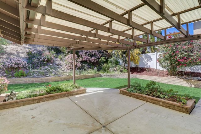 Large, private patio with cover offering shade while allowing light to come through.