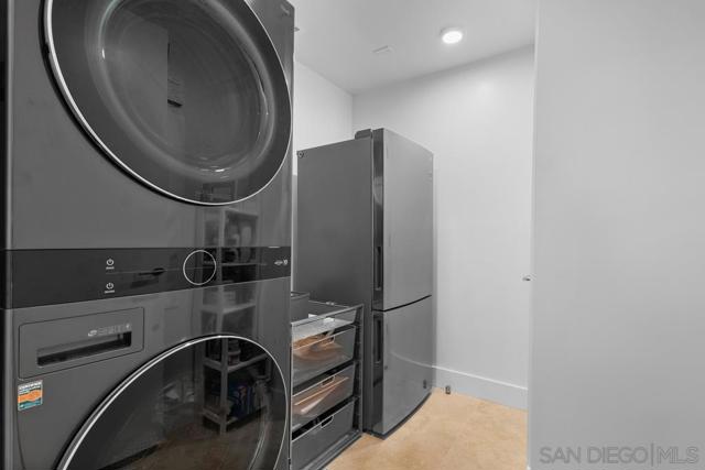 For your convenience, the laundry room features a full size LG washer, dryer and a full size LG second refrigerator for addtional storage.