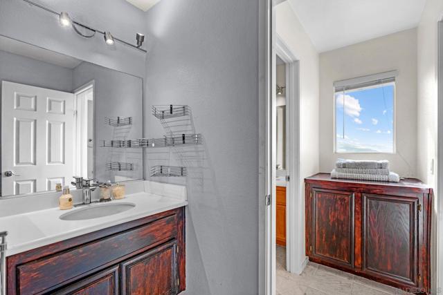 This bathroom is shared with bedroom 4. Each has its own vanity with doors close for privacy for each bedroom! I tell you this home is designed well. The bedrooms act as suites.