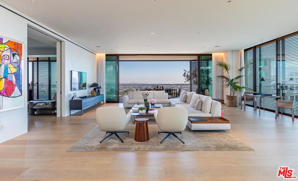 9040 W Sunset Boulevard 1201 West Hollywood, California Sited within West Hollywood's The Edition Hotel Residences, Unit #1201 showcases the renowned design of iconic British architect John Pawson and spectacular views from every room. With four ensuite bedrooms, five bathrooms and a spacious 4,678-SF floorplan, this prime residence is the second largest in the collection and offers the most scenic views. Inside, light pours in through walls of glass in the sophisticated living area. Connected is an elegant dining area and a sleek kitchen with and teak wood cabinetry. Indoor and outdoor living collide with an 834-SF deck that opens up to panoramic city and ocean views. The exceptional building amenities include a pool, spa, fitness center, restaurant, bar, office and concierge. Enjoy automated Lutron lighting, Alexa voice command a/v and access to three underground parking spaces as well as valet parking. Moments from the world-class restaurants, shopping and entertainment in West Hollywood and Beverly Hills, savor a highly sought-after location.