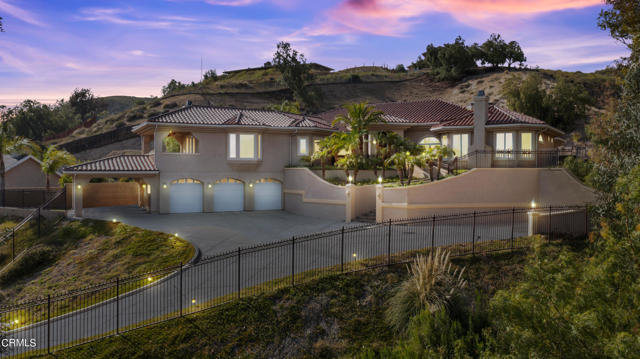 Rare opportunity to live in pure paradise with arguably the best views in Simi Valley! This gorgeous custom-built home offers the best Simi Valley has to offer. In its serene private setting, this nearly 4,000 sq ft custom built masterpiece sits high on a hill among the stars, with amazing 180-degree panoramic breathtaking views of the city lights and mountains which can be enjoyed from most every room. This home offers 3 large bedrooms with a Master suite, which includes an oversized walk-in-closet, fireplace, and of course, the city light views. Additionally, within your suite, your resort style bathroom offers his and her sinks, an oversized 'rainfall' shower, and a jacuzzi-spa tub for soothing relaxation. Commercial grade Viking appliances and custom-built, high-grade cabinetry showcase the chef's kitchen. You can also use the outdoor built in Viking BBQ conveniently located just outside the kitchen in the private sprawling green grass covered backyard which includes a led lit, pebble stone pool and jacuzzi. A 3-car garage with built-in storage, oversized carport, and plenty of additional parking space exist behind your iron gated private driveway. Enjoy all the privacy and best location in Simi Valley with easy access to the 118 fwy, connecting to the 405, 170, and 5 providing a quick 25 min drive to Burbank airport. Your dream home awaits on this 1.5+ acre lot with NO HOA!!