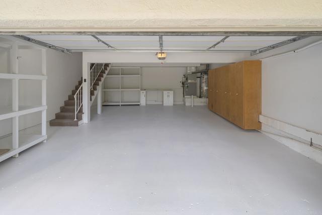 2 Car XL Garage w/ample storage space beyond! Built-in shelving + vertical closets!  Charge your EV!