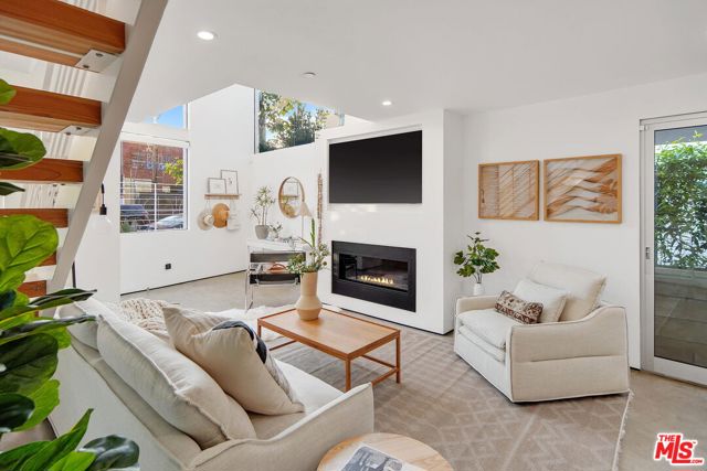 714 Hampton Drive Venice, California 2017 custom-built architectural live/work single-family residence. Open and drenched with natural light, the double-height living room features polished concrete floors, a dramatic stairway, natural gas fireplace, and sliding glass doors providing cooling ocean cross breezes. Ignite your inner chef with the gourmet custom kitchen complete with Thermador appliances and ample storage. Your dining room can also function as a conference room to take full advantage of the legal live/work zoning. The second floor features two bedrooms (or bullpens) with a shared full bath with a deep soak tub. The third floor showcases an enormous primary suite with its own fireplace, two separate balconies, and a large en suite with a steam shower. Enjoy panoramic views and relax on the rooftop deck with adjoining covered wet bar and yet another dramatic fireplace to take the chill off winter sunset viewing Bonus features include tankless hot water heater, central heat/air, secured entry, and electric blinds. Steps to Abbot Kinney, the Rose Corridor, Google, Rose Cafe, Gjusta, Golds Gym, and blocks to the beach! A short drive to LAX, SM Airport and all things Westside. Live, work and play the ultimate Venice lifestyle! Garage not included.