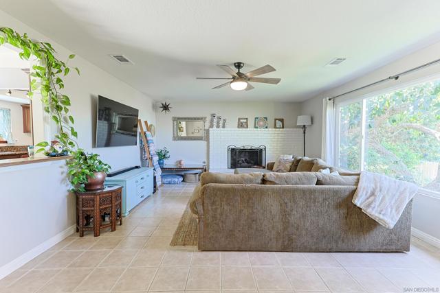 spacious living room with a custom pass-through into the dining room