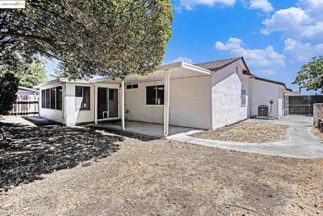 Back of property with stucco siding