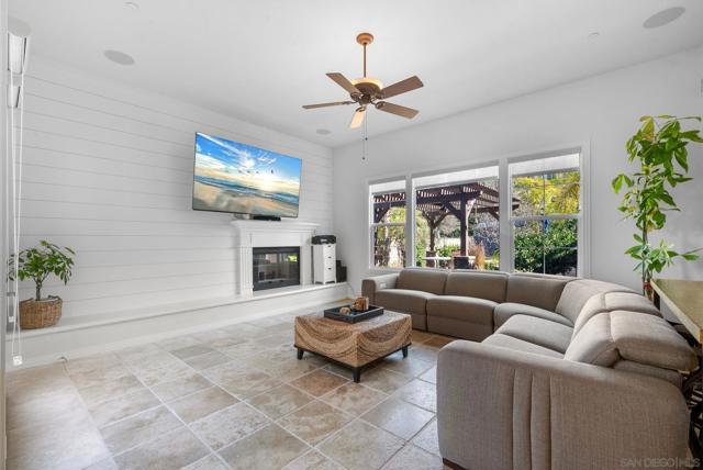 Family room with surround sound speakers in ceiling