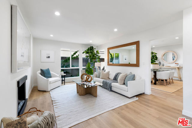 2502 Arizona Avenue 4 Santa Monica, California This remodeled front-facing, 2-story townhouse fulfills the urbanist inside you, blocks away to Erewhon & all that Santa Monica has to offer. When you need it, the aptly named "The Woods" complex whisks you away to calmer environs, thanks to the greenery outside & minimalist touches inside your unit. The lower floor features a spacious living/dining area & your own patio. A gorgeous kitchen with European cabinetry & modern countertops provide a perfect backdrop for dinner parties. The upper floor's primary suite with vaulted ceilings leaves a lasting impression & has an en-suite bathroom, plus ample closet space. The secondary bedrooms have natural bright light & share a hall bathroom with LED backlit mirror & dual vanity. Other noteworthy features include a Nest thermostat, built-in closet spaces for all bedrooms, community pool, detached 1-car garage & carport. Live in the middle of it all while having tranquility when you want it. Contact us today for a private showing.