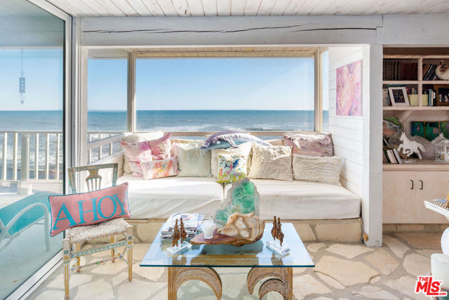 Incredible opportunity to own on 45ft of prime Malibu Road beach frontage. This two story home is on the market for the first time in almost 50 years! Offering unobstructed views down the coast capturing the twinkling Queens Necklace lights. Three bedrooms situated on the entry level including the oceanfront primary suite. The lower level has the oceanfront living room and dining area that spills out to an amazing beach patio. The fourth bedroom/guest suite, is also on the lower level. Paddle out to Malibu Colony Point surf spot, or relax while taking in the fantastic panoramic ocean views from the rooftop deck. This home is priced to sell as the Seller needs to leaseback the property for up to two years.