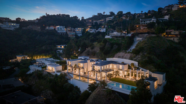 One of the most important estates ever built in the Hollywood Hills, located at the end of a cul-de-sac in the prime Bird Streets. An extraordinary blend of taste, quality and craftsmanship, impossible to replicate and featuring every conceivable amenity.  Completely private and secluded behind gates, enter into a world amongst itself. Stunning 2-story entry with sweeping staircase, a spectacular living room, gourmet kitchen/family room, formal dining room, separate chef's kitchen, media/theater, and library/office, all overlooking the incredible grounds, courtyards, lawns, and breathtaking city views.  Absolutely amazing primary suite with large sitting areas, gorgeous baths and walk-in closets. There is a full spa, including gym, sauna, cold plunge and lap pool. Beautiful estate-like grounds feature outdoor kitchen, dining, infinity pool, pickle ball court, and wonderful areas for large scale entertaining. An incredible opportunity to acquire a trophy view estate. Shown to pre-qualified clients only.