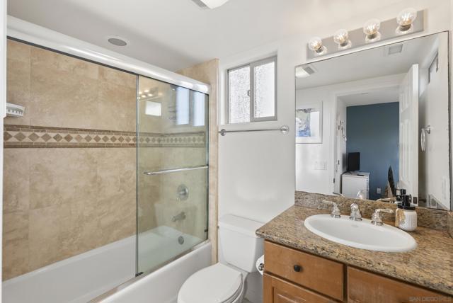 Elegant finishes lend a refined spa ambiance to this guest bath.