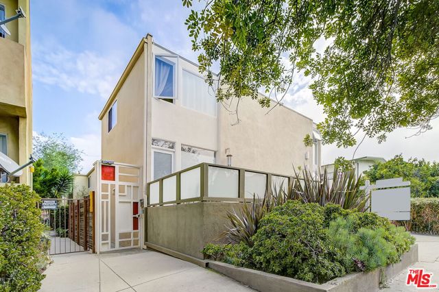 1427 25th Street 3 Santa Monica, California This lovely townhome in the heart of Santa Monica is not to be missed! Located close to grocery stores, coffee shops, restaurants as well as the Expo line and Water Gardens, you will be thrilled at the proximity this location will provide. 25th Street is a quiet tree lined street with permitted parking and no drive-through access, which creates a cozy neighborhood feel. The gated entryway leads to your new home in this highly desirable six unit building. The front door keyless entry pad provides both security and ease of access for you and your guests. The living space is open and inviting, with bamboo flooring, a ceiling fan to keep things cool, and a main level powder room. The kitchen has ample storage and counter space, with natural light flowing in from the window overlooking your large private patio. The stairway to the second level is illuminated by a large skylight and both bedrooms also have ceiling fans. The main bedroom has a large closet and lots of natural light. The second bedroom also boasts large windows and ample storage. The in-unit laundry and full bathroom are also on the second level for your convenience. There is a dedicated private garage space located at the rear of the building, with a sizable cabinet for storage. In addition, there is a designated storage closet accessible from the front of the building. Great location, two levels, ample storage and private garage parking await you!