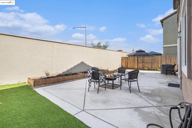 View of patio featuring an outdoor fire pit