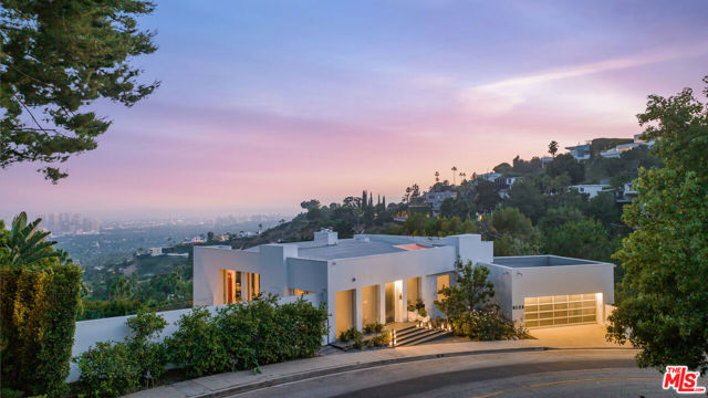 1654 N Doheny Drive Los Angeles, California Introducing 1654 N Doheny Dr., an unparalleled architectural nestled in the prestigious Doheny Estates. This remarkable home offers impressive city views and was meticulously reimagined with the finest finishes throughout, setting a new standard for luxury living with no expense spared. Inside, find natural sunlight illuminating the open and airy interiors, showcasing approximately 4643 ft. of thoughtfully designed living spaces, including four bedrooms and five bathrooms. The approximately 477 ft. 2-car garage offers ample room for all storage needs. Art gallery walls, high ceilings with floor-to-ceiling glass windows, and custom pocket doors seamlessly blend the indoor and outdoor spaces. The gourmet kitchen is a culinary dream, featuring top-of-the-line appliances, custom marble finishes, iPad-controlled TopBrewer, two dishwashers, two sinks, and ample pantry storage, elevating your dining experiences. The formal dining room offers perched city views to enjoy year-round. Retreat to the primary bedroom, where you'll find a one-of-a-kind marble en-suite bathroom complete with heated floors, a steam shower, and Jacuzzi tub. A custom-designed, Saint Laurent-inspired primary closet, complemented by two additional walk-in closets, offers an abundance of room for your finest wardrobe pieces. Step outside for breathtaking jetliner views stretching from the cityscape all the way to the ocean. The outdoor space features a sunbathing deck/patio, heated pool, oversize spa, built-in barbecue, two gas fireplaces, a fenced dog run, and large flat grass areas. Other features include a game room, theater, interior/exterior built-in Sonos speakers, an alarm system, security cameras, fingerprint access, built-in window shades, a home generator, and the option to be equipped for any home smart system. Perfectly situated near the famed Sunset Strip, Sunset Plaza, and Beverly Hills, this location offers the best of both privacy and convenience, with world-class dining, shopping, and entertainment options at your fingertips. Live the ultimate luxury lifestyle in one of Los Angeles' most sought-after locations.