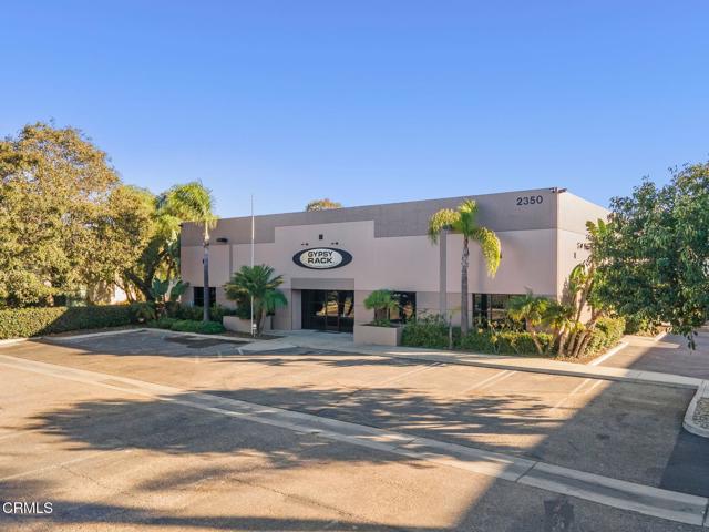 Welcome to a remarkable free-standing industrial/warehouse building sitting on a generous 44,341 sq ft lot in a thriving HUBZone, conveniently located near the 101 freeway, PCH, and Port Hueneme. This well-maintained commercial building offers an excellent opportunity for a business seeking space in a thriving area of Ventura County. Located in the heart of Oxnard's industrial zone, the property is ideal for manufacturing, distribution, and office use. This property is not just a building; it's a canvas for your business aspirations.Step inside and be captivated by the stunning marble reception area, setting a professional tone for your operations. The layout includes well-appointed private office spaces, perfect for productivity and collaboration. The building spans approximately 12,243 square feet on the ground floor. The expansive 2,750 sq ft permitted mezzanine offers ample additional storage and/or office space, while three ground-level loading doors streamline your logistics. A fully equipped kitchen ensures that your team stays energized and engaged throughout the day.Constructed in 1997, it includes over 1,150 square feet of office space, one bathroom equipped with a walk-in shower, a half bathroom, and three ground level loading doors. This property can accommodate a large production and requires minimal maintenance, and is ideal for an owner operator, light manufacturing, or simply car collector/''man cave''. Zoned for Limited Manufacturing (LM), this property provides flexibility for various industrial uses. Beyond the impressive interior, enjoy nearly 3,000 sq ft of secure gated yard space, ideal for outdoor operations or additional storage. A low, quarterly HOA ensures the exterior is in pristine shape. Plus, 24 parking stalls surround the building, accommodating both employees and visitors effortlessly.Rest easy knowing the property is under 24/7 security monitoring by Boyd & Associates, ensuring peace of mind for your business. This is more than just a space; it's an opportunity to elevate your operations in a desirable Southern California location.