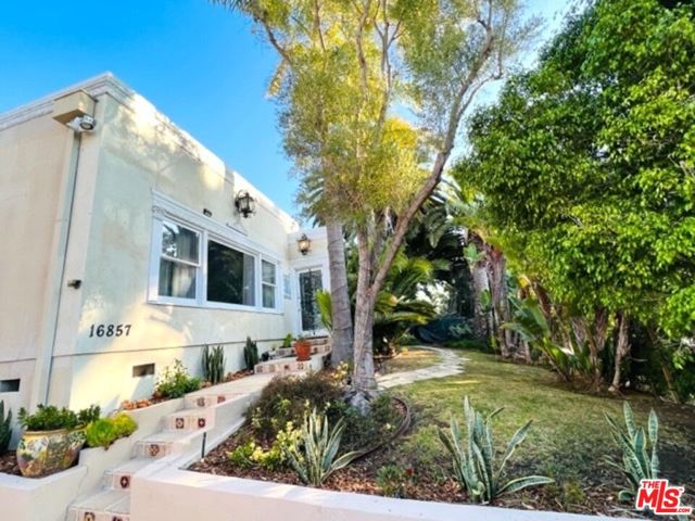16857 W Sunset Boulevard Pacific Palisades, California Welcome to your exclusive, private Pacific Palisades oasis. The home is quietly set-back from the road behind a hedge and gate, Enjoy the light and bright, large, single-level, open floor plan with an oversized living & dining room. Double-glazed windows and custom, floor to ceiling picture windows frame the lush, flowered foliage surrounding the house and backyard. Triple French doors lead outside to the pool and patio. The spacious kitchen is equipped with Viking appliances, an island & bar and a dining area that leads to the spacious backyard with a swimmer's pool, outdoor grill and kitchen. The bedrooms are all spacious with plentiful closet space. The master bedroom with ensuite bathroom opens to the backyard. All bathrooms are unique and custom designed. Skylights located throughout the house allow natural sunlight to pour through. Two large fireplaces with custom details add character to the oversized living room and bedroom. Enjoy the unique, hand-carved wooden doors, wrought iron details on the front door, stained glass windows or remodel to suit your taste. The possibilities are endless. There is a small ocean view from the front bedroom. Adding a second level would provide spectacular ocean views. The property is not located within the Coastal Commission so acquiring planning permission is quick and easy. There is space to park at least 4 vehicles There is an additional, separate guest house that is fully equipped with a private patio and a full kitchen and bathroom. Located a short walk to the beach, within close proximity to the Palisades Village and Lake Shrine. This property is a must see!