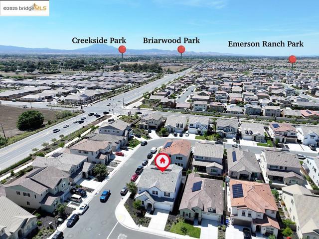 Aerial view of residential area featuring a mountain backdrop