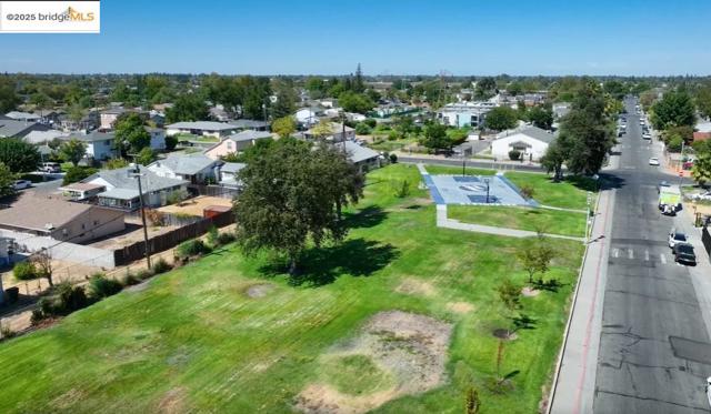 View of property location with nearby suburban area