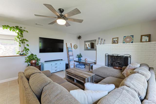 spacious living room with a custom pass-through into the dining room