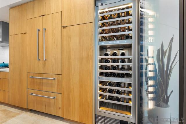 For the wine connoisseur, a custom built-in 100 bottle capacity, triple zone Dacor wine refrigerator.