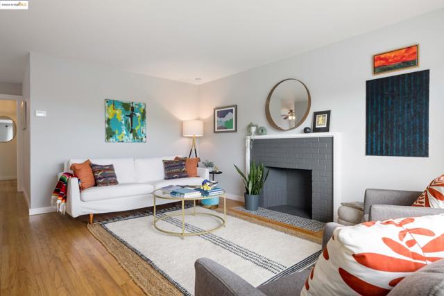 Living area with a fireplace and wood finished floors