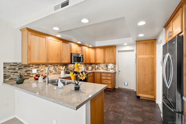 Beautifully updated kitchen with breakfast bar.  Refrigerator included